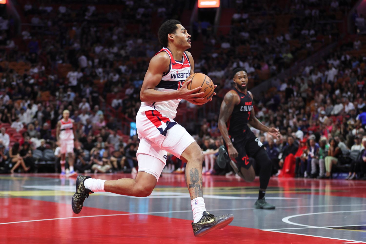 Washington Wizards guard Jordan Poole (13) drives to the basket against the Miami Heat during the first quarter at Kaseya Center.